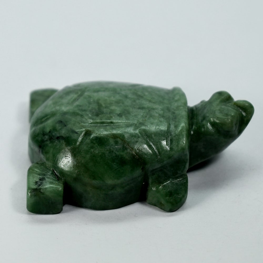 Natural Green Jade 244.46 Ct. Turtle Carving Size 35 x 50 x 16 Mm.: Product ID: 818102424 Product Name: Natural Gemstones Weight: 244.46 CT. Size: 35 x 50 x 16 MM. Shape: Caving Color: multi Color Green Clarity:Opaque Luster: Good Gems Origin: Burma Treatment: Unheate