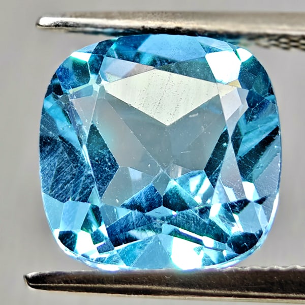 Natural Swiss Blue Topaz 5.00 Ct. Cushion Shape 10.2 Mm Gemstone From Brazil: Product ID: 807167899 Product Name: Natural Blue Topaz Weight: 5.00 CT. Size: 10.2 x 10.2 x 5.9 MM. Shape: Cushion Shape Color: Swiss Blue Clarity:VSI Luster: Good Gems Origin: Brazil Treatment: Treat