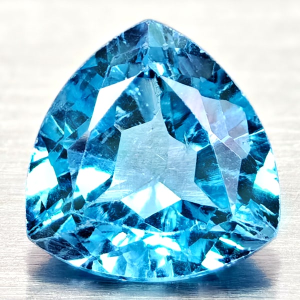 Natural Swiss Blue Topaz 3.18 Ct. Trilliant Shape 9.1 Mm Gemstone From Brazil: Product ID: 807167936 Product Name: Natural Blue Topaz Weight: 3.18 CT. Size: 9.1 x 9.1 x 5.3 MM. Shape: Trilliant Color: Swiss Blue Clarity:VSI Luster: Good Gems Origin: Brazil Treatment: Treated Cry