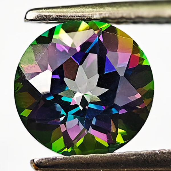 Natural Mystic Green Topaz 1.57 Ct. Round Shape 7 Mm. Gemstone From Brazil: Product ID: 807167782 Product Name: Natural Topaz Weight: 1.57 CT. Size: 7 x 7 x 4.8 MM. Shape: Round Color: Mystic Clarity:VSI Luster: Very Good Gems Origin: Brazil Treatment: Treated Crystal Structu