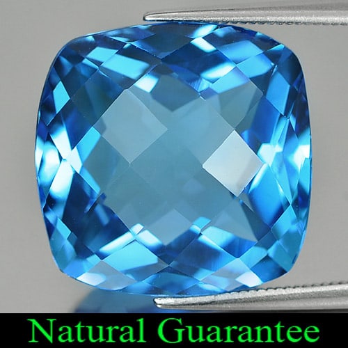 Natural Swiss Blue Topaz 29.72 Ct. Clean Cushion Checkerboard Cut 18 x 18 Mm. Gemstone From Brazil: Product ID: 807158506 Product Name: Natural Blue Topaz Weight: 29.72 CT. Size: 18 x 18 x 11.2 MM. Shape: Cushion Checkerboard Color: Swiss Blue Clarity:IF Luster: Very Good Gems Origin: Brazil Treatme