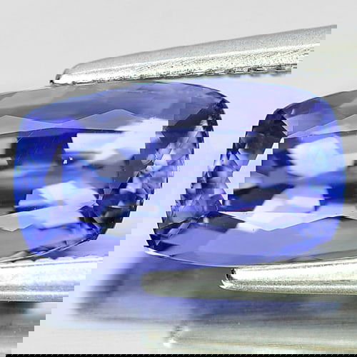 Natural Violetish Blue Tanzanite 1.79 Ct. Clean Cushion Shape 9 x 4.7 Mm. Gemstone From Tanzania: Product ID: 807006568 Product Name: Natural Tanzanite Weight: 1.79 CT. Size: 9 x 4.7 x 3.4 MM. Shape: Cushion Color: Violetish Blue Clarity:IF Luster: Very Good Gems Origin: Tanzania Treatment: Heated