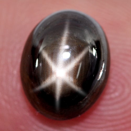 Natural Black Star Sapphire 6 Rays 3.67 Ct. Oval Cabochon Shape 9.2 x 7.4 Mm. Gemstone From Thailand: Product ID: 806135388 Product Name: Natural Star Sapphire Weight: 3.67 CT. Size: 9.2 x 7.4 x 4.6 MM. Shape: Oval Cabochon Color: Black Clarity:Opaque Luster: Good 6 Rays Star Gems Origin: Thailand Tre