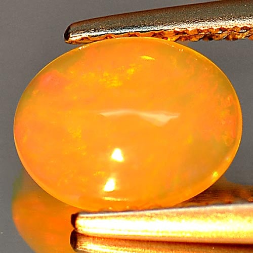Natural Multi Color Opal 0.73 Ct. Oval Cabochon Shape 8.1 x 6.2 Mm. Unheated Gemstone: Product ID: 818726338 Product Name: Natural Opal Weight: 0.73 CT. Size: 8.1 x 6.2 x 3.3 MM. Shape: Oval Cabochon Color: Multi Color Clarity:Semi - Transparent Luster: Iridescent Gems Origin: Ethiopia 