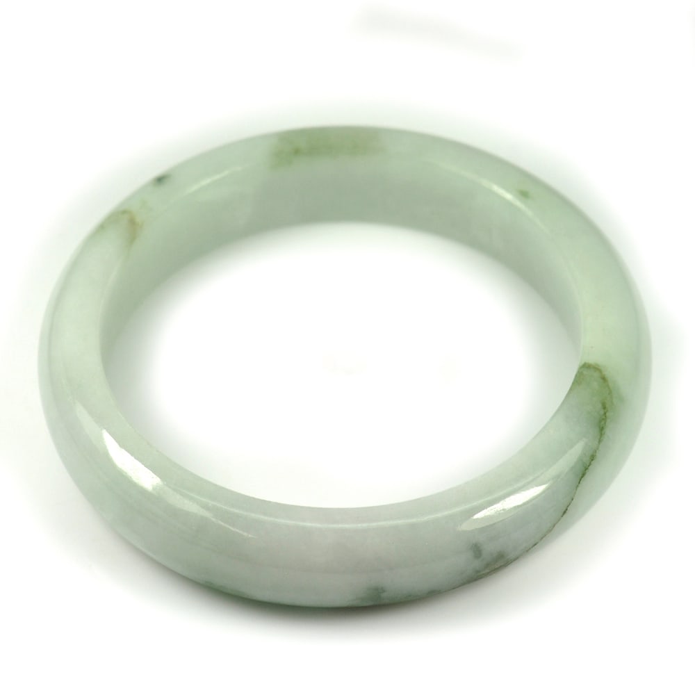 Natural Green Jade Bangle Size 75 x 56 x 13 Mm. 300.13 Ct. Unheated Gemstone: Product ID: 819814885 Product Name: Natural Jade Weight: 300.13 CT. Size: 75 x 56 x 13 MM. Shape: Round Color: Green Clarity:Opaque Luster: Good Gems Origin: Thailand Treatment: Unheated Crystal Struc