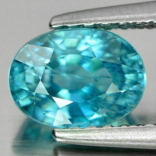 Natural Blue Zircon 1.64 Ct. Oval Shape 7 x 5.1 Mm. Gemstone From Cambodia: Product ID: 807724122 Product Name: Natural Zircon Weight: 1.64 CT. Size: 7 x 5.1 x 4.1 MM. Shape: Oval Color: Blue Clarity:SI Luster: Good Gems Origin: Cambodia Treatment: Heated Crystal Structure: T