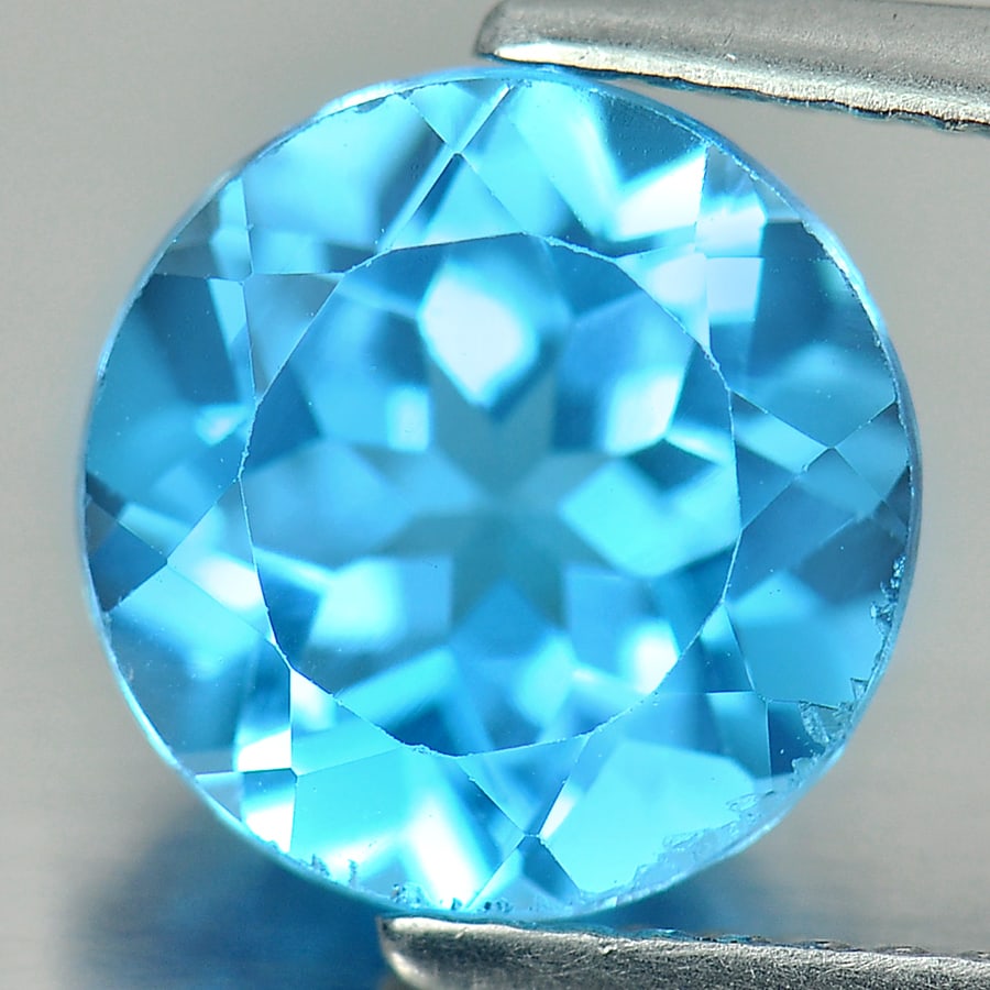 Natural Swiss Blue Topaz 3.08 Ct. Round Shape 9 Mm. Gemstone From Brazil: Product ID: 807156257 Product Name: Natural Blue Topaz Weight: 3.08 CT. Size: 9 x 9 x 5.4 MM. Shape: Round Color: Swiss Blue Clarity:VSI Luster: Good Gems Origin: Brazil Treatment: Treated Crystal Str