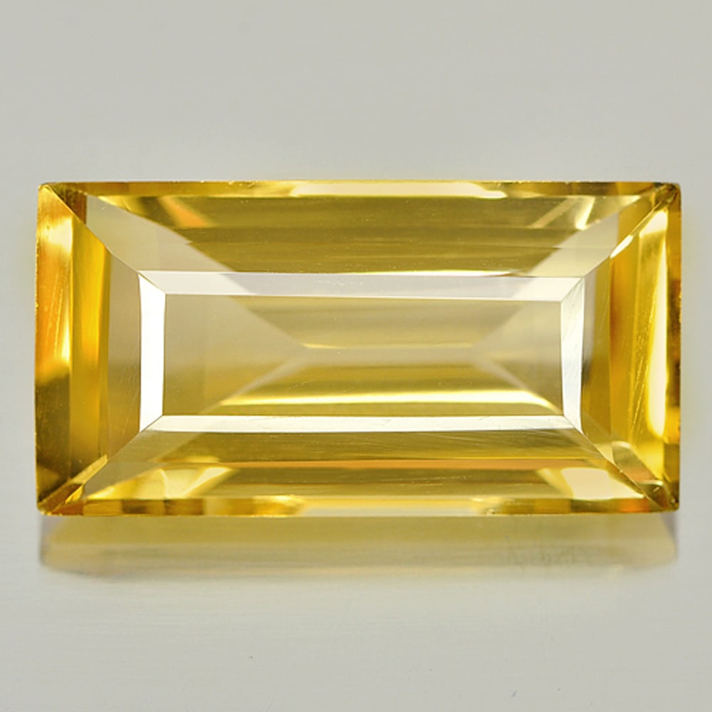 Natural Yellow Citrine 9.75 Ct. VVS Baguette Shape 19.3 x 10 Mm. Unheated Gemstone From Brazil: Product ID: 801809530 Product Name: Natural Citrine Weight: 9.75 CT. Size: 19.3 x 10 x 6.7 MM. Shape: Baguette Color: Yellow Clarity:VVS Luster: Good Gems Origin: Brazil Treatment: Unheated Crystal St