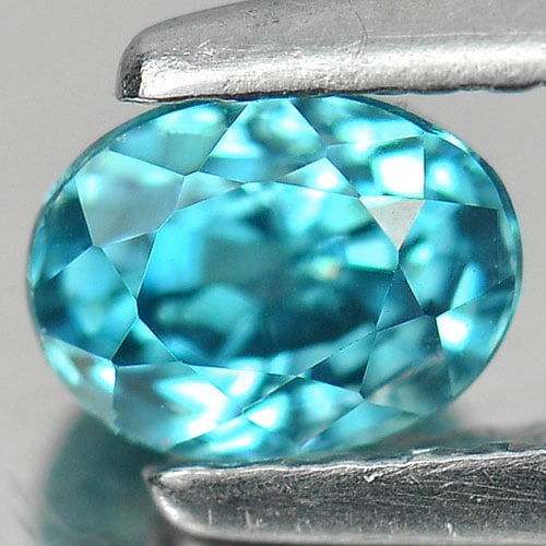 Natural Blue Zircon 0.98 Ct. Clean Oval Shape 5.4 x 4.2 Mm. Gemstone From Cambodia: Product ID: 807712999 Product Name: Natural Zircon Weight: 0.98 CT. Size: 5.4 x 4.2 x 4 MM. Shape: Oval Color: Blue Clarity:IF Luster: Good Gems Origin: Cambodia Treatment: Heated Crystal Structure: T