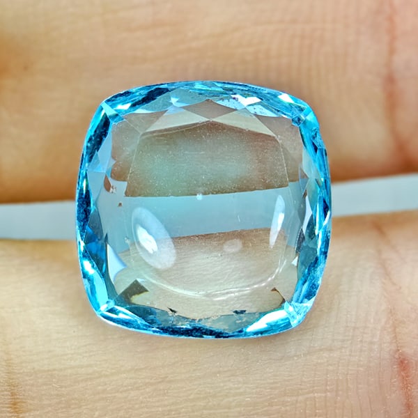 Natural Swiss Blue Topaz 6.74 Ct. Cushion Cabochon Shape 12.1 Mm Gemstone From Brazil: Product ID: 807167894 Product Name: Natural Blue Topaz Weight: 6.74 CT. Size: 12.1 x 12.1 x 4.2 MM. Shape: Cushion Cabochon Color: Swiss Blue Clarity:VSI Luster: Good Gems Origin: Brazil Treatment: Tr