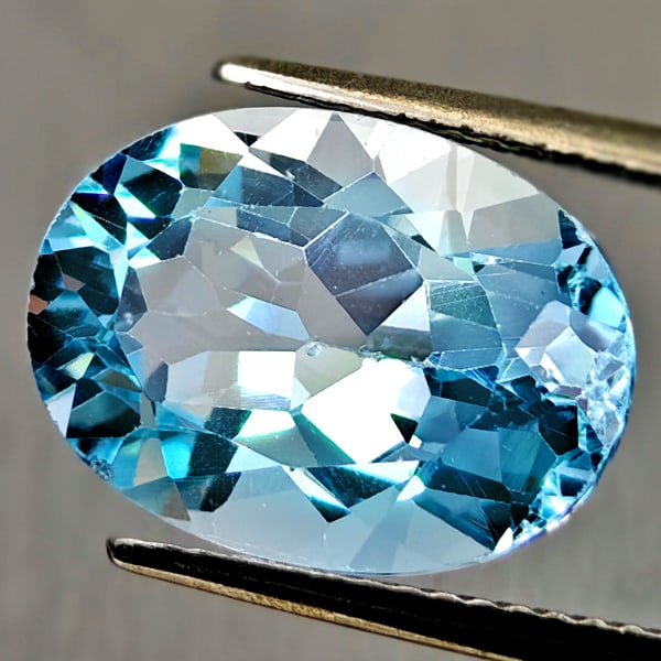 Natural Swiss Blue Topaz 7.90 Ct. Oval Shape 14 x 10.2 Mm Gemstone From Brazil: Product ID: 807167911 Product Name: Natural Blue Topaz Weight: 7.90 CT. Size: 14 x 10.2 x 7.5 MM. Shape: Oval Color: Swiss Blue Clarity:VSI Luster: Good Gems Origin: Brazil Treatment: Treated Crystal 