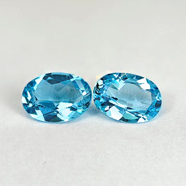 Natural Swiss Blue Topaz 1.62 Ct. 2 Pcs Oval Shape 7 x 5 Mm. Gemstones From Brazil: Product ID: 807167803 Product Name: Natural Blue Topaz Weight: 1.62 CT. Size: 7 x 5 x 2.9 MM. Shape: Oval Color: Swiss Blue Clarity:VSI Luster: Good Gems Origin: Brazil Treatment: Treated Crystal Stru