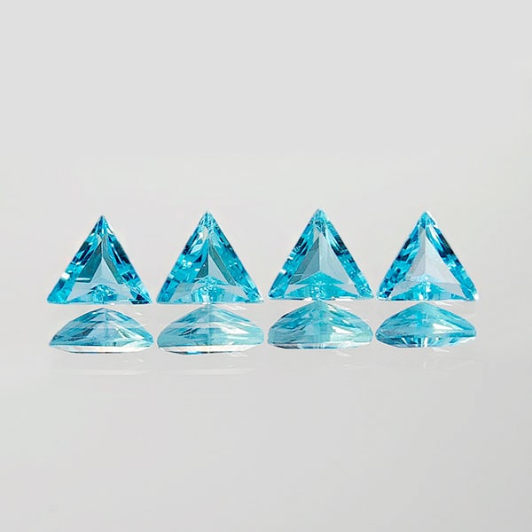 Natural Swiss Blue Topaz 2.12 Ct. 4 Pcs Trilliant Shape 6.5 x 6.5 Mm. Gemstones From Brazil: Product ID: 807167766 Product Name: Natural Blue Topaz Weight: 2.12 CT. Size: 6.5 x 6.5 x3 MM. Shape: Trilliant Color: Blue Clarity:VVS Luster: Good Gems Origin: Brazil Treatment: Treated Crystal Stru