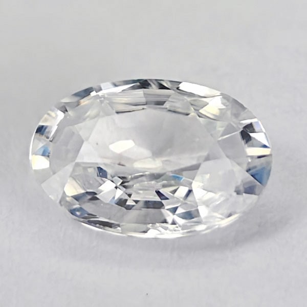 Natural White Zircon 0.98 Ct. Oval Shape 7 x 5 Mm. Gemstone From Cambodia: Product ID: 807742859 Product Name: Natural Zircon Weight: 0.98 CT. Size: 7 x 5 x 2.8 MM. Shape: Oval Color: White Clarity:VSI Luster: Good Gems Origin: Cambodia Treatment: Heated Crystal Structure: T