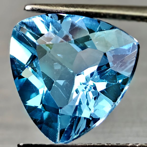 Natural Swiss Blue Topaz 6.05 Ct. Trilliant Shape 12 Mm Gemstone From Brazil: Product ID: 807167927 Product Name: Natural Blue Topaz Weight: 6.05 CT. Size: 12 x 12 x 6.5 MM. Shape: Trilliant Color: Swiss Blue Clarity:VSI Luster: Good Gems Origin: Brazil Treatment: Treated Cryst
