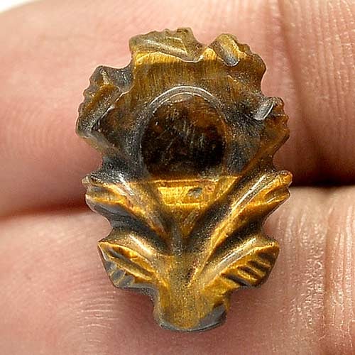 Natural Golden Tiger Eye 11.59 Ct. Leaves Carving 19.6 x 13.5 Mm. Gemstone From Thailand: Product ID: 811600136 Product Name: Natural Tiger eye Weight: 11.59 CT. Size: 19.6 x 13.5 x 6.9 MM. Shape: Carving Leaves Color: Golden Clarity:Opaque Luster: Good Gems Origin: Thailand Treatment: Unh