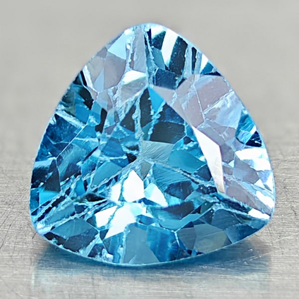 Natural Swiss Blue Topaz 3.28 Ct. Trilliant Shape 9 Mm Gemstone From Brazil: Product ID: 807167866 Product Name: Natural Blue Topaz Weight: 3.28 CT. Size: 9 x 9 x 6.2 MM. Shape: Trilliant Color: Swiss Blue Clarity:VSI Luster: Good Gems Origin: Brazil Treatment: Treated Crystal