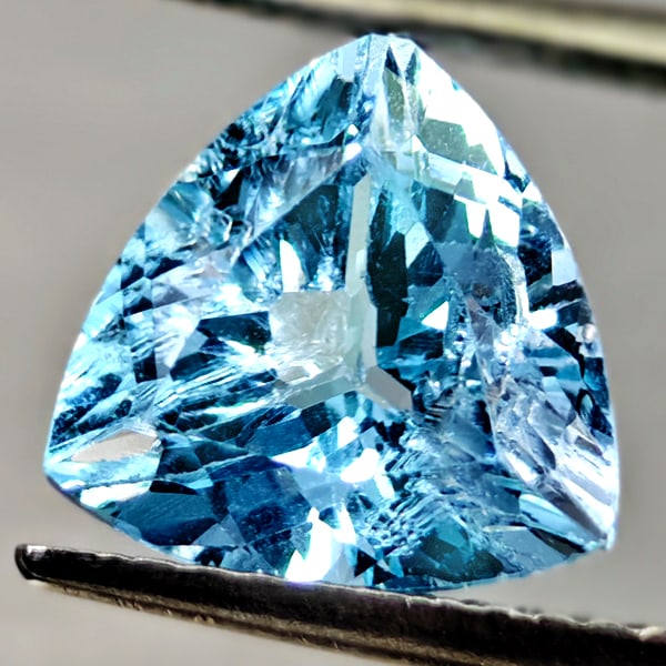 Natural Swiss Blue Topaz 2.94 Ct. Trilliant Shape 9.10 Mm Gemstone From Brazil: Product ID: 807167923 Product Name: Natural Blue Topaz Weight: 2.94 CT. Size: 9.10 x 9.10 x 5.8 MM. Shape: Trilliant Color: Swiss Blue Clarity:VSI Luster: Good Gems Origin: Brazil Treatment: Treated C