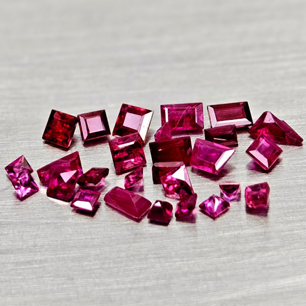 Natural Purplish Pink Ruby 1.51 Ct. 27 Pcs Mixed Shape Gemstones From Mozambique: Product ID: 805935213 Product Name: Natural Ruby Weight: 1.51 CT. Size: 2.9 x 2.9 x 1.5 to 1.6 x 1.6 x 0.9 MM. Shape: Mixed Shape Color: Purplish Pink Clarity:VSI - SI1 Luster: Good Gems Origin: Mozam