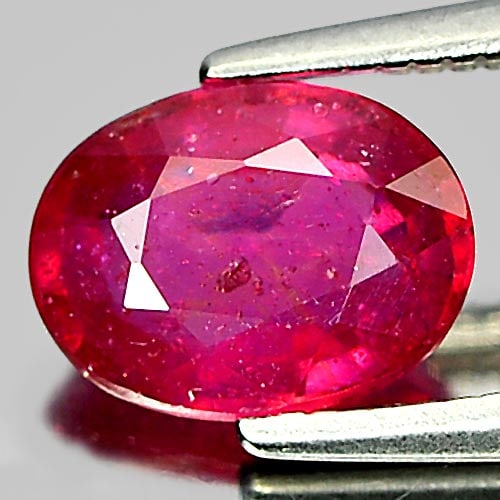 Natural Purplish Pink Ruby 1.57 Ct. Oval Shape 8 x 6.1 Mm. Gemstone From Mozambique: Product ID: 805923533 Product Name: Natural Ruby Weight: 1.57 CT. Size: 8 x 6.1 x 3.4 MM. Shape: Oval Color: Purplish Pink Clarity:VSI Luster: Good Gems Origin: Mozambique Treatment: Heated (Lead-glas