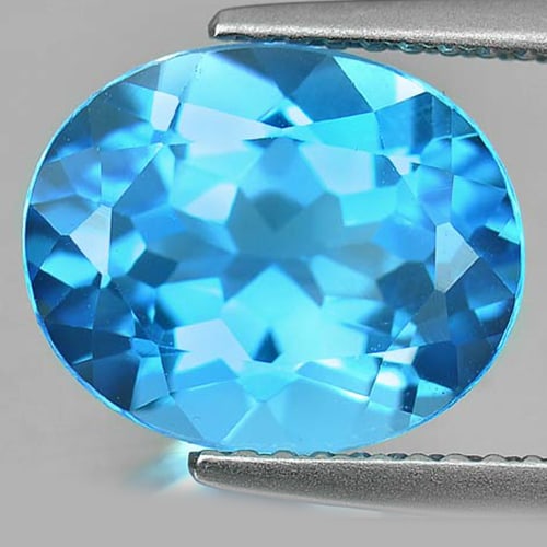 Natural Swiss Blue Topaz 4.66 Ct. VVS Oval Shape 11 x 9 x 6.2 Mm. Gemstone From Brazil: Product ID: 807160650 Product Name: Natural Blue Topaz Weight: 4.66 CT. Size: 11 x 9 x 6.2 MM. Shape: Oval Color: Swiss Blue Clarity:VVS Luster: Good Gems Origin: Brazil Treatment: Treated Crystal Str