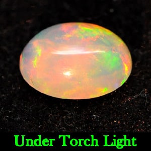 Natural Multi Color Opal 0.83 Ct. Oval Cabochon Shape 8.1 x 6.1 Mm. Gemstone: Product ID: 818721933 Product Name: Natural Opal Weight: 0.83 CT. Size: 8.1 x 6.1 x 3.5 MM. Shape: Oval Cabochon Color: Multi Color Clarity:Semi - Transparent Luster: Strong Iridescent Gems Origin: Et