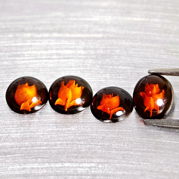 Natural Brown Yellow Amber 1.80 Ct. 4Pcs Flower Carving In Mixed Shape Cabochon: Product ID: 819091046 Product Name: Natural Amber Weight: 1.80 CT. Size: 7.9 x 6.8 x 3.2 to 7.3 x 7.3 x 3.2 MM. Shape: Mixed Shape Cabochon Color: Brown Yellow Clarity:Semi - Transparent Luster: Good 