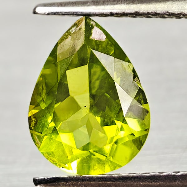 Natural Green Peridot 1.65 Ct. Pear Shape 9.1 x 7 Mm Gemstone From Pakistan: Product ID: 805317088 Product Name: Natural Green Sapphire Weight: 1.65 CT. Size: 9.1 x 7 x 4.2 MM. Shape: Pear Shape Color: Green Clarity:VSI Luster: Good Gems Origin: Pakistan Treatment: Unheated Cr