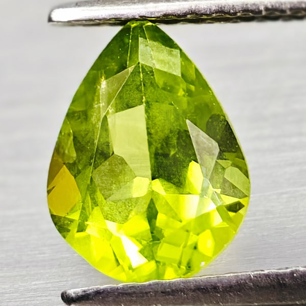 Natural Green Peridot 1.68 Ct. Pear Shape 8.9 x 6.8 Mm Gemstone From Pakistan: Product ID: 805317091 Product Name: Natural Green Sapphire Weight: 1.68 CT. Size: 8.9 x 6.8 x 4.4 MM. Shape: Pear Shape Color: Green Clarity:VSI Luster: Good Gems Origin: Pakistan Treatment: Unheated 