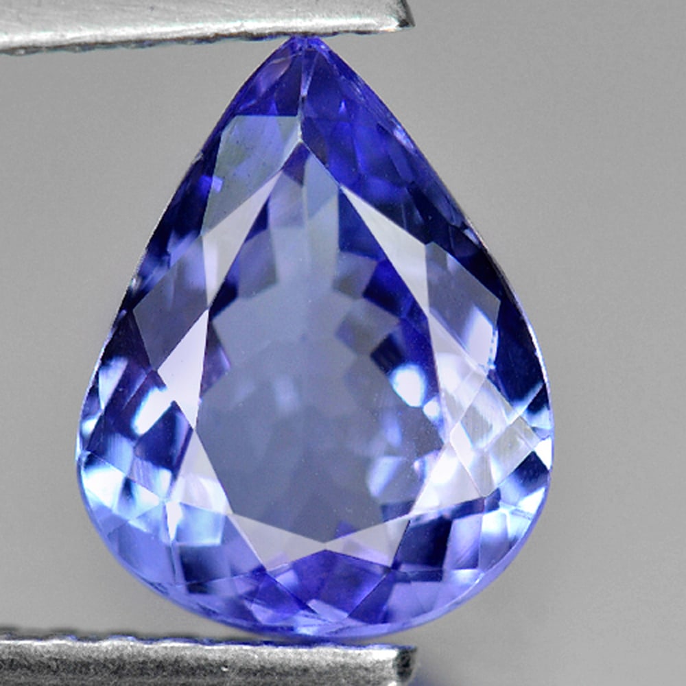 Natural Violetish Blue Tanzanite 1.53 Ct. Clean Pear Shape 8.9 x 6.9 Mm. Gemstone From Tanzania: Product ID: 807009353 Product Name: Natural Tanzanite Weight: 1.53 CT. Size: 8.9 x 6.9 x 3.7 MM. Shape: Pear Color: Violetish Blue Clarity:IF Luster: Good Gems Origin: Tanzania Treatment: Heated Cryst