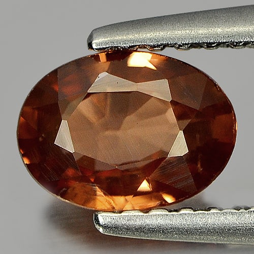 Imperial Zircon 0.88 Ct. Oval Shape 6.8 x 5 Mm. Natural Gemstone From Cambodia: Product ID: 807730165 Product Name: Natural Zircon Weight: 0.88 CT. Size: 6.8 x 5 x 2.5 MM. Shape: Oval Color: Imperial Clarity:VSI Luster: Good Gems Origin: Cambodia Treatment: Heated Crystal Structu