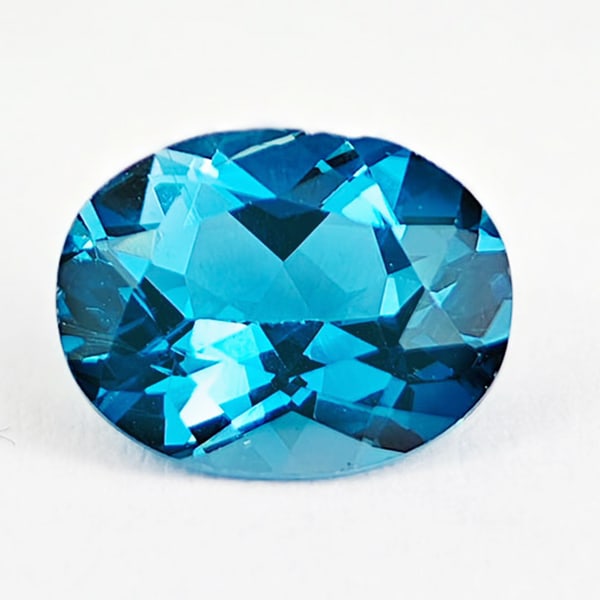 Natural London Blue Topaz 2.22 Ct. Oval Shape 9 x 7 Mm. Gemstone From Brazil: Product ID: 807167791 Product Name: Natural Blue Topaz Weight: 2.22 CT. Size: 9 x 7 x 4.7 MM. Shape: Oval Color: London Blue Clarity:VSI Luster: Good Gems Origin: Brazil Treatment: Treated Crystal Str