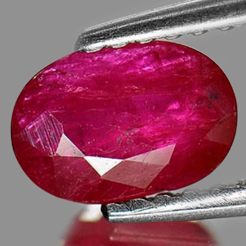 Natural Purplish Pink Ruby 1.03 Ct. Oval Shape 7.1 x 5 Mm Gemstone From Madagascar: Product ID: 805923483 Product Name: Natural Ruby Weight: 1.03 CT. Size: 7.1 x 5 x 3.1 MM. Shape: Oval Color: Purplish Pink Clarity:VSI Luster: Good Gems Origin: Madagascar Treatment: Heated (Lead-glas