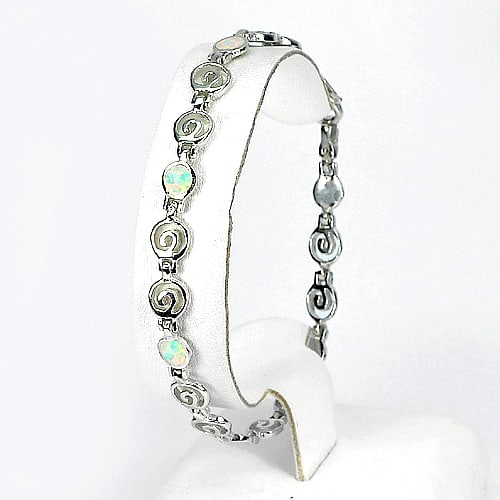 925 Sterling Silver Bracelet Jewelry 8.36 Grams 8 Inch. Spiral Key Created Opal Multi Color: Product ID: 280160005 / Product Type: 925 Sterling Silver Fine Jewelry / Jewelry Weight: 8.36 Grams. / Gemstones Color: Multi-Color / Metal: Solid Silver 92.5%. / Gemstone Detail: Average Range 8.36 -