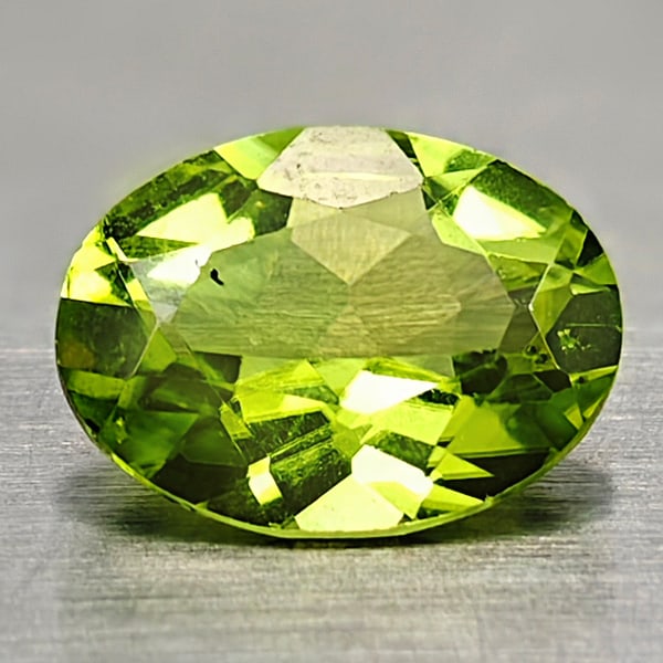 Natural Green Peridot 0.93 Ct. Oval Shape Size 8 x 6 Mm. Gemstones From Pakistan: Product ID: 805316985 Product Name: Natural Peridot Weight: 0.93 CT. Size: 8 x 6 x 3 MM. Shape: Oval Color: Green Clarity:VSI Luster: Good Gems Origin: Pakistan Treatment: Unheated Crystal Structure: 