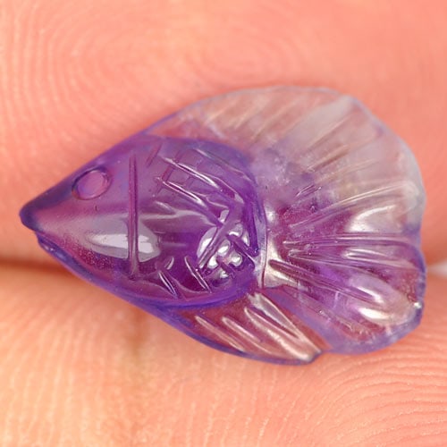 Natural Purple Amethyst 2.63 Ct. Fish Carving Size 14 x 9.7 Mm. Gemstone Unheated From Brazil: Product ID: 810304015 Product Name: Natural Amethyst Weight: 2.63 CT. Size: 14 x 9.7 x 4.4 MM. Shape: Fish Carving Color: Purple Clarity:Semi - Transparent Luster: Good Gems Origin: Brazil Treatment: 