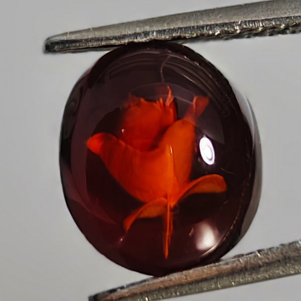 Natural Amber 0.53 Ct. Flower Carving In Oval Cabochon Shape 8.8 x 7.7 Mm Gemstone From Poland: Product ID: 819090974 Product Name: Natural Amber Weight: 0.53 CT. Size: 8.8 x 7.7 x 3.3 MM. Shape: Oval Cabochon Color: Brown Yellow Clarity:Semi - Transparent Luster: Good Gems Origin: Poland Treatm