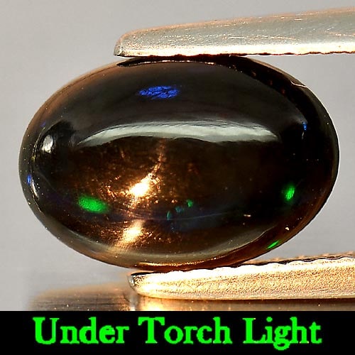 Natural Fire Red Black Opal 1.44 Ct. Oval Shape 11.1 x 7.6 Mm. Gemstone From Ethiopia: Product ID: 818724442 Product Name: Natural Opal Weight: 1.44 CT. Size: 11.1 x 7.6 x 3.8 MM. Shape: Oval Cabochon Color: Multi-Color Clarity:Semi - Transparent Luster: Iridescent Gems Origin: Ethiopia