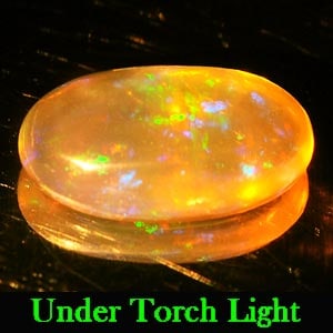 Natural Multi Color Opal 1.15 Ct. Oval Cabochon Shape 10.1 x 6.2 Mm Gemstone From Ethiopia: Product ID: 818711161 Product Name: Natural Opal Weight: 1.15 CT. Size: 10.1 x 6.2 x 3.4 MM. Shape: Oval Cabochon Color: Multi Color Clarity:Semi - Transparent Luster: Iridescent Gems Origin: Ethiopia