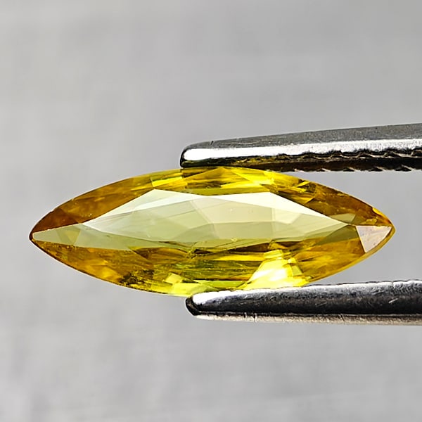 Natural Green Sphene With Rainbow Spark 0.82 Ct. Marquish Shape 11.4 x 4.4 Mm Gemstone: Product ID: 806509038 Product Name: Natural Sphene Weight: 0.82 CT. Size: 11.4 x 4.4 x 2 MM. Shape: Marquise Shape Color: Yellow Green With Rainbow Spark Clarity:SI1 Luster: Good Gems Origin: Madagasc