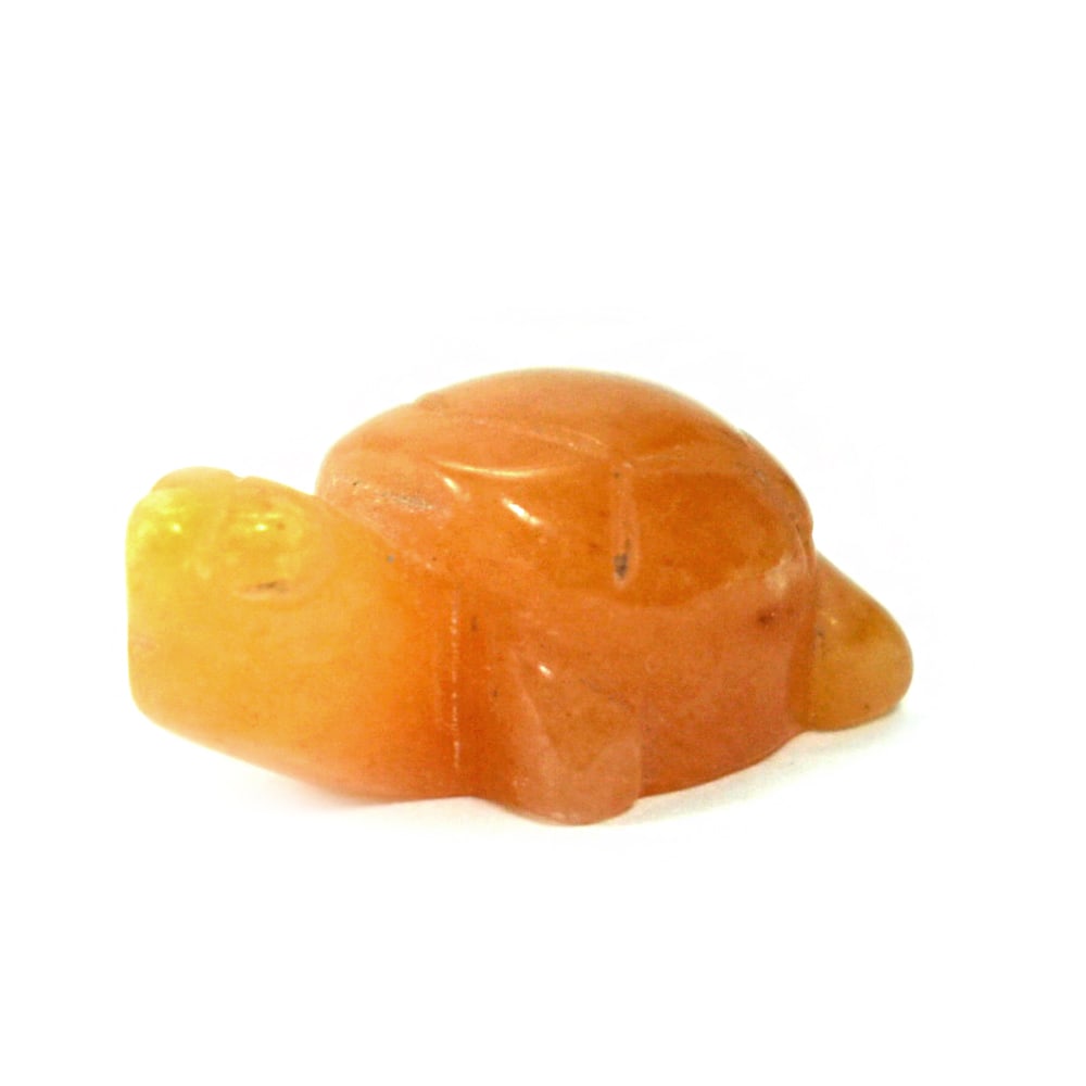 Natural Honey Jade 24.25 Ct. Turtle Carving Size 14 x 23 x 10 Mm.: Product ID: 818102512 Product Name: Natural Gemstones Weight: 24.25 CT. Size: 14 x 23 x 10 MM. Shape: Caving Color: brown Honey Clarity:Opaque Luster: Good Gems Origin: Burma Treatment: Unheated Cryst