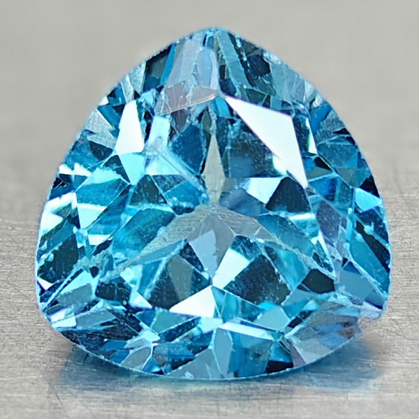 Natural Swiss Blue Topaz 3.44 Ct. Trilliant Shape 9 Mm Gemstone From Brazil: Product ID: 807167875 Product Name: Natural Blue Topaz Weight: 3.44 CT. Size: 9.1 x 9.1 x 6 MM. Shape: Trilliant Color: Swiss Blue Clarity:VSI Luster: Good Gems Origin: Brazil Treatment: Treated Cryst