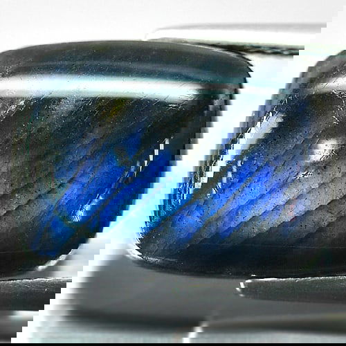 Natural Multi Color Blue Labradorite Doublet 8.77 Ct. Baguette Cabochon Shape 16 x 12 Mm. Gemstone: Product ID: 804301205 Product Name: Natural Labradorite Weight: 8.77 CT. Size: 16 x 12 x 4.8 MM. Shape: Baguette Cabochon Color: Multi-Color Clarity:Opaque Luster: Iridescent Gems Origin: Canada Treat