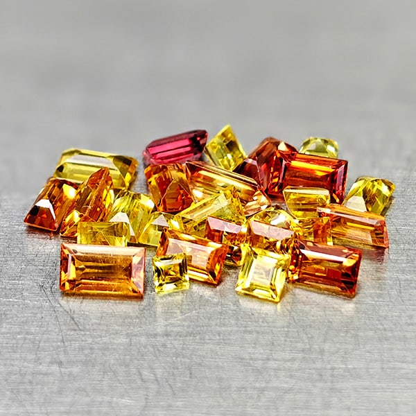 Natural Orange Yellow Sapphire 2.83 Ct. 26 Pcs Mixed Shape 3.7 x 2.2 Mm Gemstones From Tanzania: Product ID: 806161914 Product Name: Natural Fancy Color Sapphire Weight: 2.83 CT. Size: 3.7 x 2.2 x 1.2 MM. Shape: Mixed Shape Color: Orange Yellow Clarity:VSI Luster: Good Gems Origin: Tanzania Treat