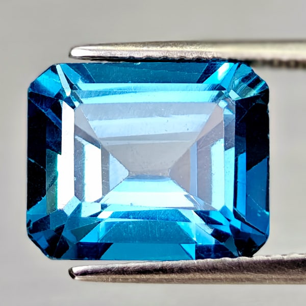 Natural Swiss Blue Topaz 7.41 Ct. Octagon Shape 12.2 x 10.2 Mm Gemstone From Brazil: Product ID: 807168030 Product Name: Natural Blue Topaz Weight: 7.41 CT. Size: 12.2 x 10.2 x 6.8 MM. Shape: Octagon Color: Swiss Blue Clarity:VSI Luster: Good Gems Origin: Brazil Treatment: Treated Cry