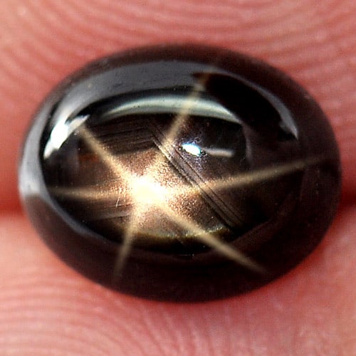 Natural Black Star Sapphire 6 Rays 2.62 Ct. Oval Cabochon Shape 8.7 x 6.9 Mm Gemstone From Thailand: Product ID: 806139721 Product Name: Natural Star Sapphire Weight: 2.62 CT. Size: 8.7 x 6.9 x 3.9 MM. Shape: Oval Cabochon Color: Black Clarity:Opaque Luster: Good 6 Rays Star Gems Origin: Thailand Tre