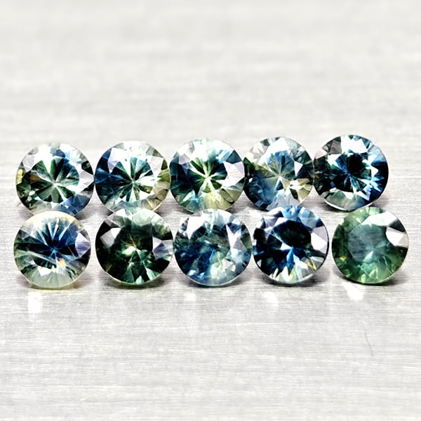 Natural Fancy Color Sapphire 1.25 Ct. 10 Pcs Round Diamand Cut 3.1 Mm Gemstones From Tanzania: Product ID: 806162162 Product Name: Natural Green Sapphire Weight: 1.25 CT. Size: 3.1 x 3.1 x 2 MM. Shape: Round Diamond Cut Color: Fancy Color Clarity:VSI Luster: Very Good Gems Origin: Tanzania Trea
