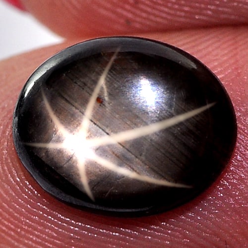 Natural Black Star Sapphire 6 Rays 4.48 Ct. Oval Cabochon Shape 11.5 x 9.4 Mm. Gemstone From: Product ID: 806132910 Product Name: Natural Star Sapphire Weight: 4.48 CT. Size: 11.5 x 9.4 x 3.8 MM. Shape: Oval Cabochon Color: Black Clarity:Opaque Luster: Good 6 Rays Star Gems Origin: Thailand Tr