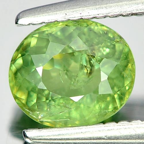 Natural Green Demantoid Garnet 0.84 Ct. Oval Shape 6 x 5 Mm Unheated Gemstone From Madagascar: Product ID: 802919145 Product Name: Natural Demantoid Weight: 0.84 CT. Size: 6 x 5 x 3.2 MM. Shape: Oval Color: Green Clarity:SI1 Luster: Good Gems Origin: Madagascar Treatment: Unheated Crystal Struc