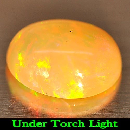 Natural Multi Color Play Of Colour Opal 0.88 Ct. Oval Cabochon Shape 8 x 6.1 Mm Gemstone From: Product ID: 818725550 Product Name: Natural Opal Weight: 0.88 CT. Size: 8 x 6.1 x 3.6 MM. Shape: Oval Cabochon Color: Multi Color Clarity:Semi - Transparent Luster: Iridescent Gems Origin: Ethiopia Tr